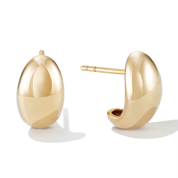 Gold hoop earrings on a white background